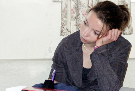 teen student leaning her head on her hand