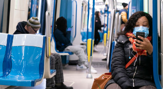 people riding subway with masks on