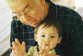 grandpa with a tot in his lap