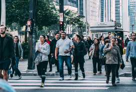 pedestrians on sidewalk and crossing street