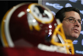 football helmet with Washington NFL franchise owner Daniel Snyder in background